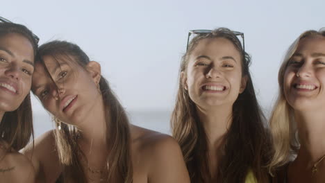 Handheld-shot-of-smiling-woman-looking-at-camera-on-beach